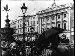 Watch Leisurely Pedestrians, Open Topped Buses and Hansom Cabs with Trotting Horses Viooz